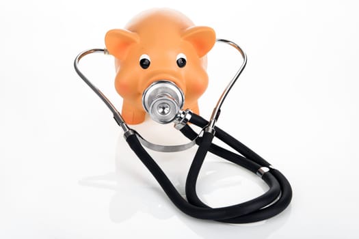 Money box with stethoscope on a bright background concept health costs