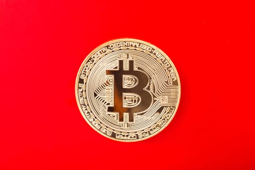 Bitcoin exposed on red background