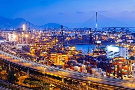 container terminal and stonecutter bridge in Hong Kong at sunset