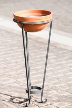 Ashtray with metal clay in  the harbour