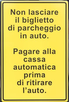 Metal sign with directions and instructions in Italian