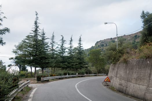 Lonely road before Novara di Sicilia little village on nebrodi mountain