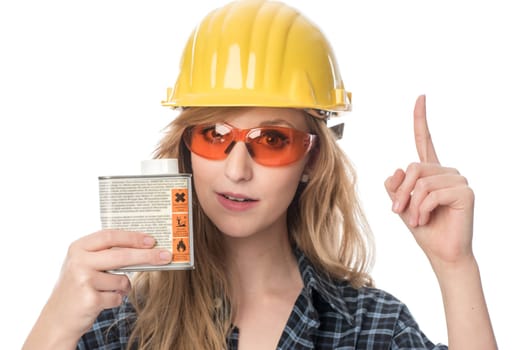 Craftsman with goggles holds paint can