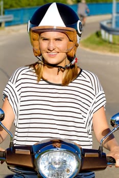 Young woman on the scooter