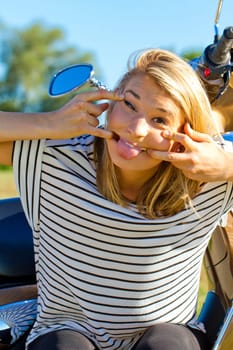 Young blonde woman makes a grime
