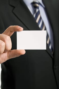 Hand of businessman offering business card on white background