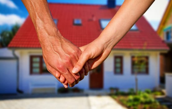 Couple in front of the new house