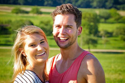 Young,happy couple out in nature