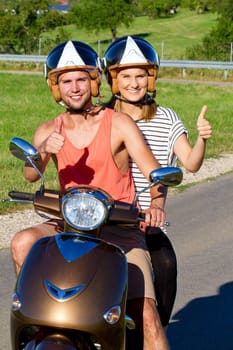 Young couple with scooter