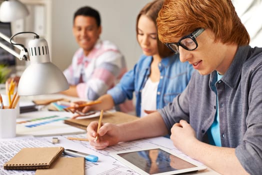 Group of students learning to make sketches in college