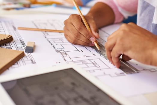 Hands of male architect making sketch