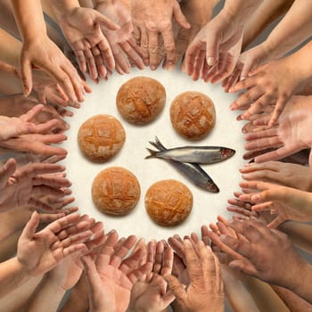 Many hands stretching around five small barley loaves and two small fish