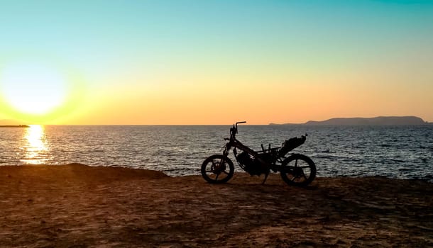 Burned abandoned motorcycle on the beach - Zakynthos / Zante Island, Greece