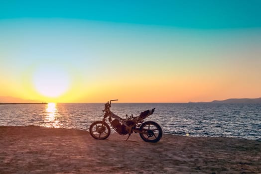 Burned abandoned motorcycle on the beach - Zakynthos / Zante Island, Greece