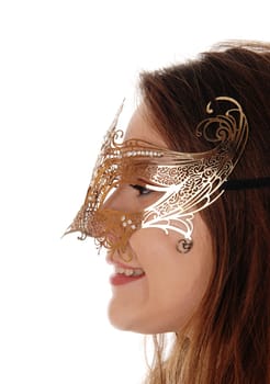 A head shot of a young gorgeous woman with long brunette hair.wearing a gold mask on her face, isolated for white background.