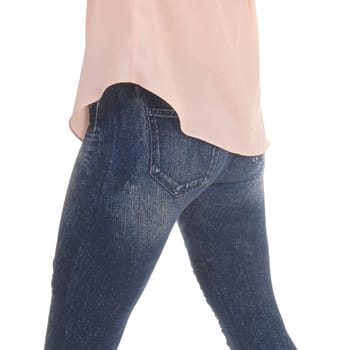 A close up image of the legs and butt of a young woman in jeans.and pink blouse standing from back, isolated for white background.