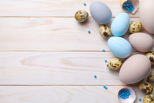 easter background with easter eggs. copy space. top view