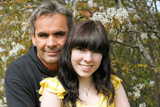 Father and daughter enjoy the sun in spring. Portrait of a father with his daughter