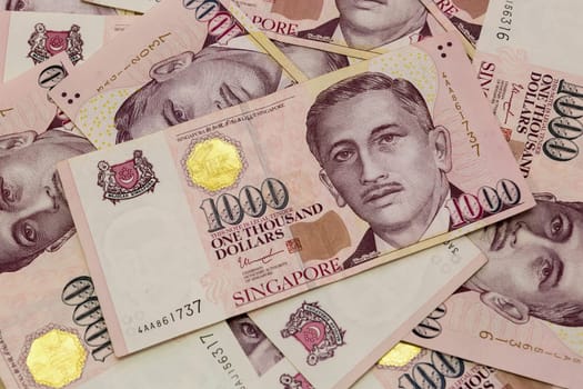 Singapore currency one thousand dollars bill notes closeup macro background