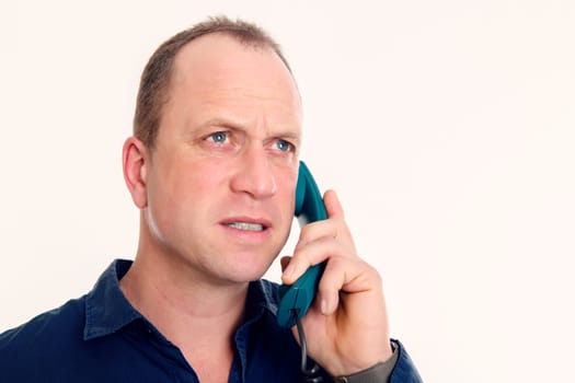 man calling with green phone in front of white background