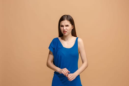 Reject, rejection, doubt concept. Disgust woman with thoughtful expression making choice. Young emotional woman. Human emotions, facial expression concept. Front . Studio. Isolated on trendy pastel