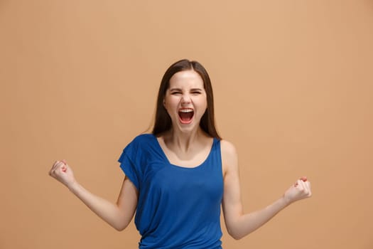 I won. Winning success happy woman celebrating being a winner. Dynamic image of caucasian female model on pastel studio background. Victory, delight concept. Human facial emotions concept. Trendy colors