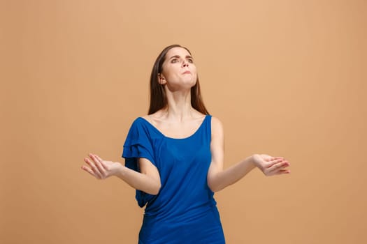 Argue woman. Aggressive angry business woman standing isolated on trendy pastel studio background. Female half-length portrait. Human emotions, facial expression concept. Front view.