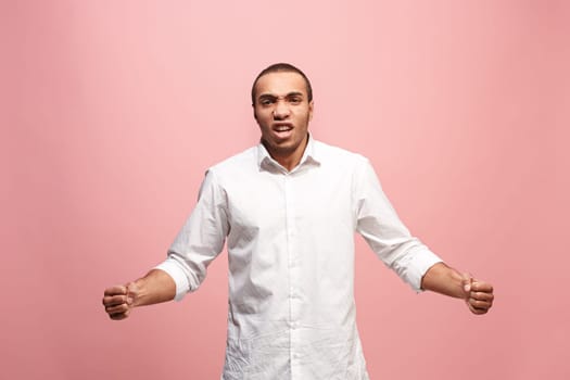 Screaming, hate, rage. Crying emotional angry afro man screaming on pink studio background. Emotional, young face. male half-length portrait. Human emotions, facial expression concept. Trendy colors