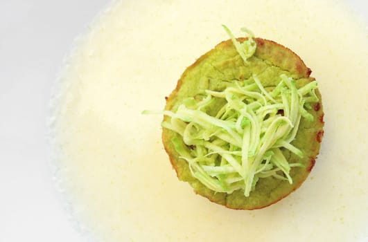 Flan zucchini cake on white plate. Flat lay.
