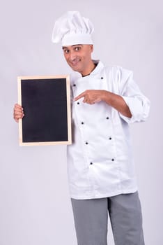 Male Chef with a menu board