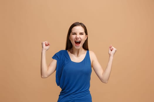 I won. Winning success happy woman celebrating being a winner. Dynamic image of caucasian female model on pastel studio background. Victory, delight concept. Human facial emotions concept. Trendy colors