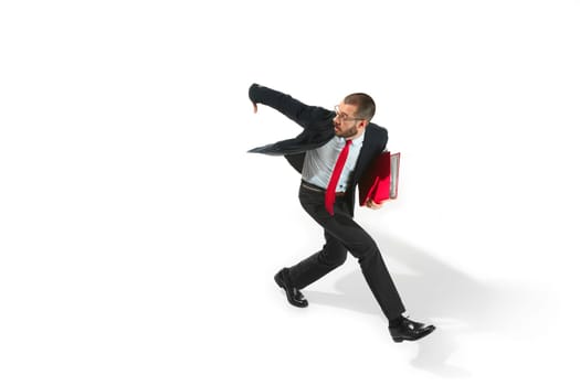 Businessman running with a folder isolated on white background