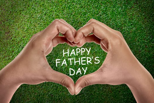 Heart shape from hands with text Happy fathers day. Fathers day concept