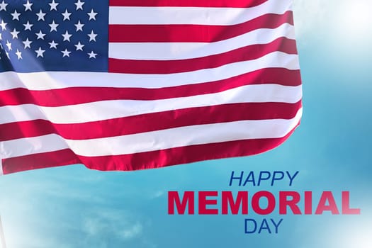 Happy memorial day with american flag waving over blue sky background