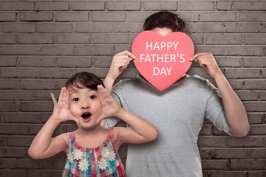 Playful asian little girl with her dad playing together. Fathers day concept