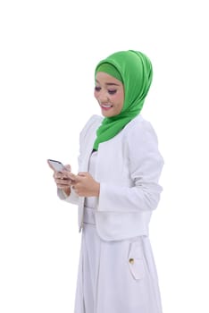 Image of asian muslim woman using smartphone isolated over white background