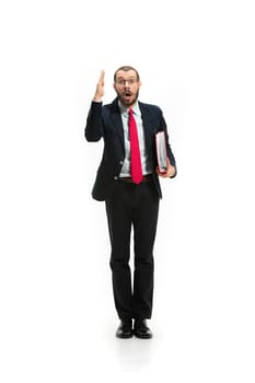 Choose me. Concept of choose the best candidate. Full body view of businessman raising his hand on white studio background. Serious bearded young man in glasses, suit. Business, career concept.