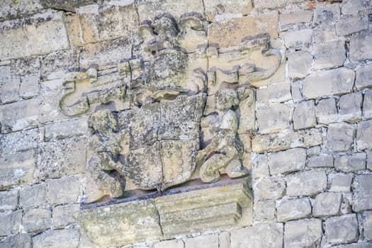 Stone shield detail in the Sabiote village castle, Jaen, Spain
