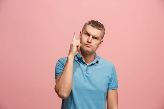 Remember all. Let me think. Doubt concept. Doubtful, thoughtful man remembering something. Young emotional man. Human emotions, facial expression concept. Studio. Isolated on trendy pink. Front