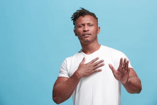 Remember all. Let me think. Doubt concept. Doubtful, thoughtful Afro-Fmerican man remembering something. Young emotional man. Human emotions, facial expression concept. Studio. Isolated on trendy blue