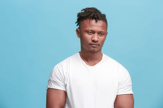 Why is that. Beautiful male half-length portrait isolated on trendy pink studio backgroud. Young emotional surprised, frustrated and bewildered man. Human emotions, facial expression concept.