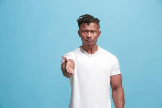 I choose you and order. African american businessman point you, want you, half length closeup portrait on blue studio background. The human emotions, facial expression concept. Front view. Trendy colors