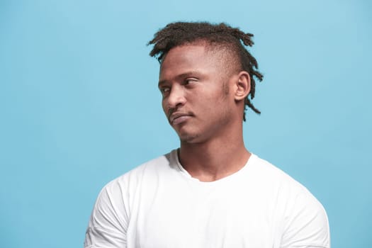 I am tired of everything. Bored man. Boring, dull, tedious concept. Young caucasian emotional man. Human emotions, facial expression concept. Studio Isolated on trendy blue background
