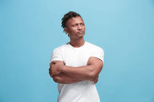 Remember all. Let me think. Doubt concept. Doubtful, thoughtful Afro-Fmerican man remembering something. Young emotional man. Human emotions, facial expression concept. Studio. Isolated on trendy blue