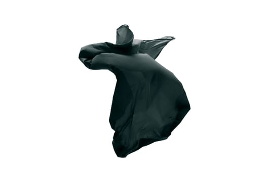 Smooth elegant transparent black cloth separated on gray background. Texture of flying fabric.