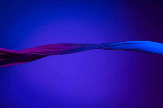 Smooth elegant transparent blue cloth isolated or separated on dark blue studio background. Texture of flying silk fabric.