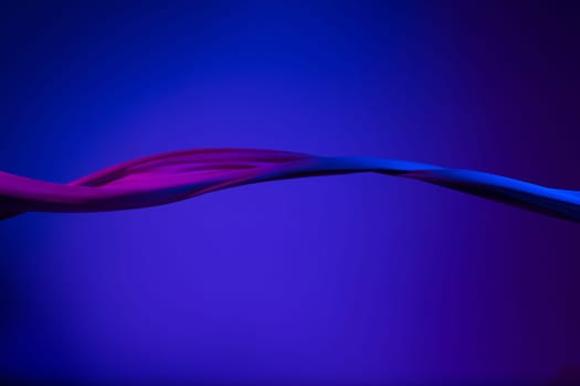 Smooth elegant transparent blue cloth isolated or separated on dark blue studio background. Texture of flying silk fabric.
