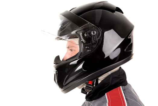 Racing driver posing with helmet isolated in white
