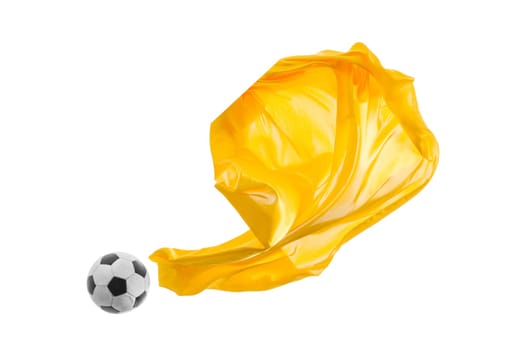 Soccer ball and Smooth elegant transparent yellow cloth isolated or separated on white studio background. Texture of flying fabric. yellow. Attributes of popular game. Concept of national flag color