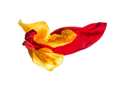 Smooth elegant transparent yellow, red, cloth isolated or separated on white studio background. Texture of flying fabric.